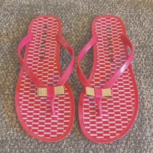 Coach pink jelly flip flops gold bow front size 7 B